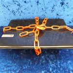 Laptop locked with a padlock and chain