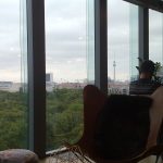 Bright modern office workspace with desks and city view