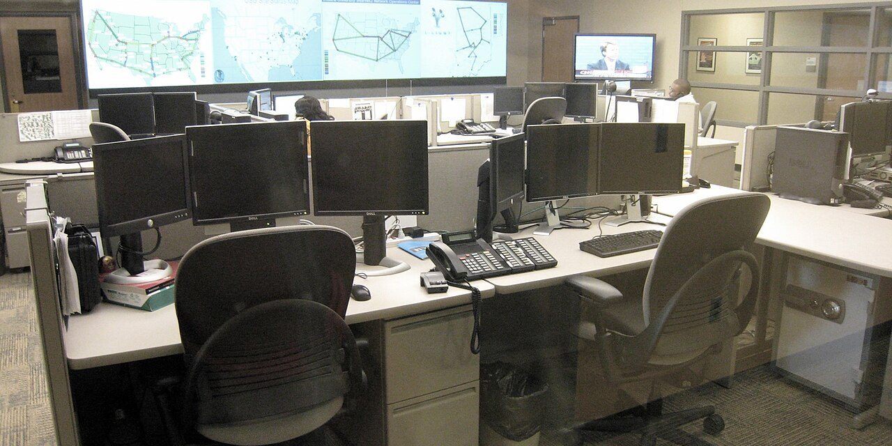 Network operations center with monitoring screens