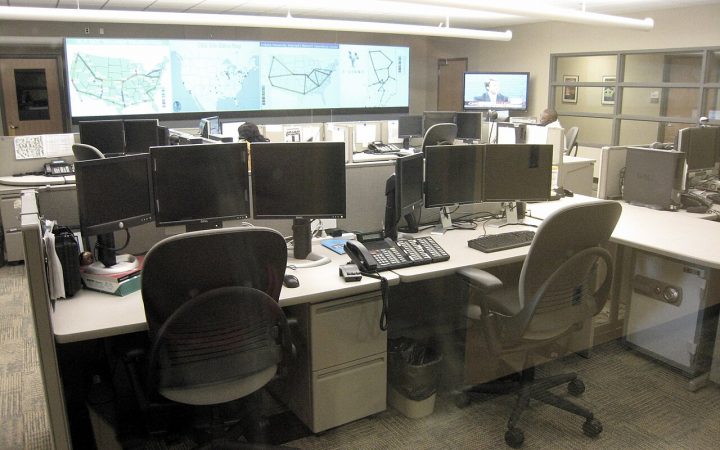 Network operations center with monitoring screens