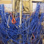 Network cable closet with blue patch cables