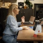Remote employee working on a laptop in a home office