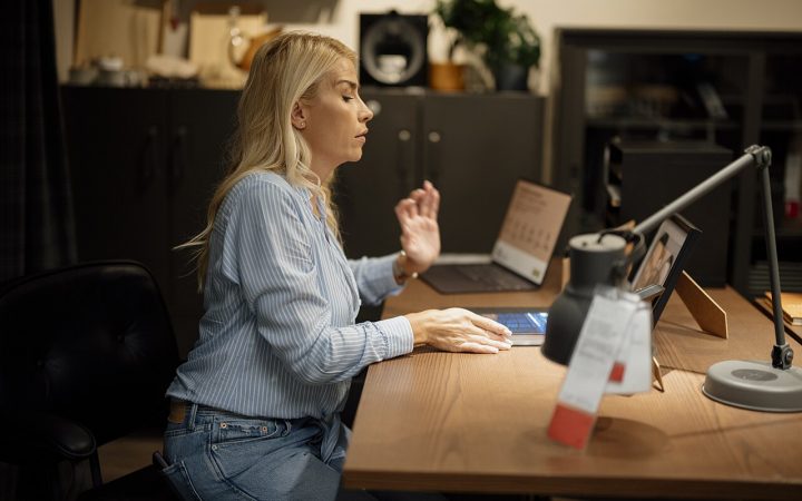 Remote employee working on a laptop in a home office