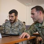 Participants collaborating during a cybersecurity training exercise