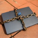 Laptop secured with a chain and padlock